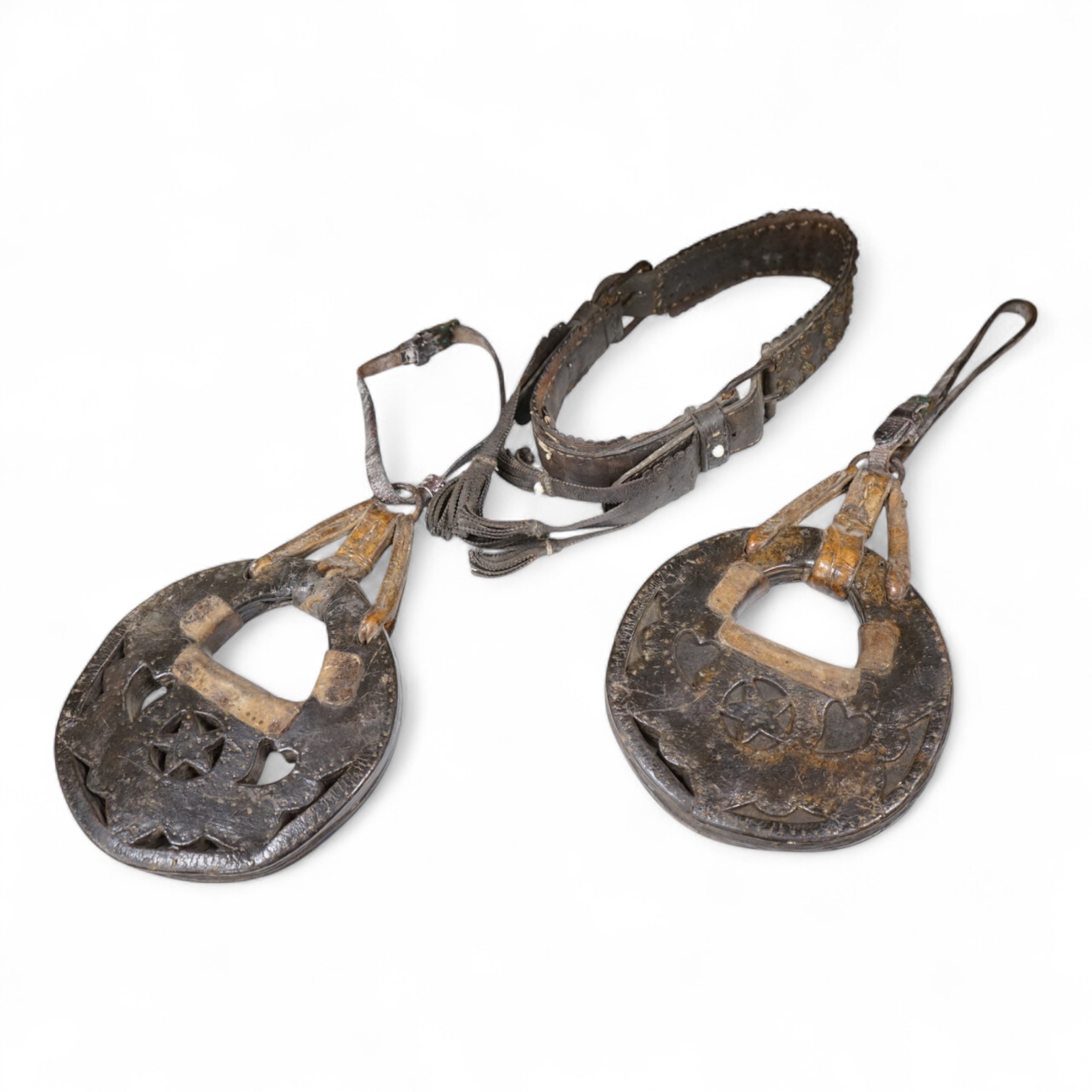 A pair of Argentinian Gaucho leather and piqué work stirrups together with a similar brass mounted belt